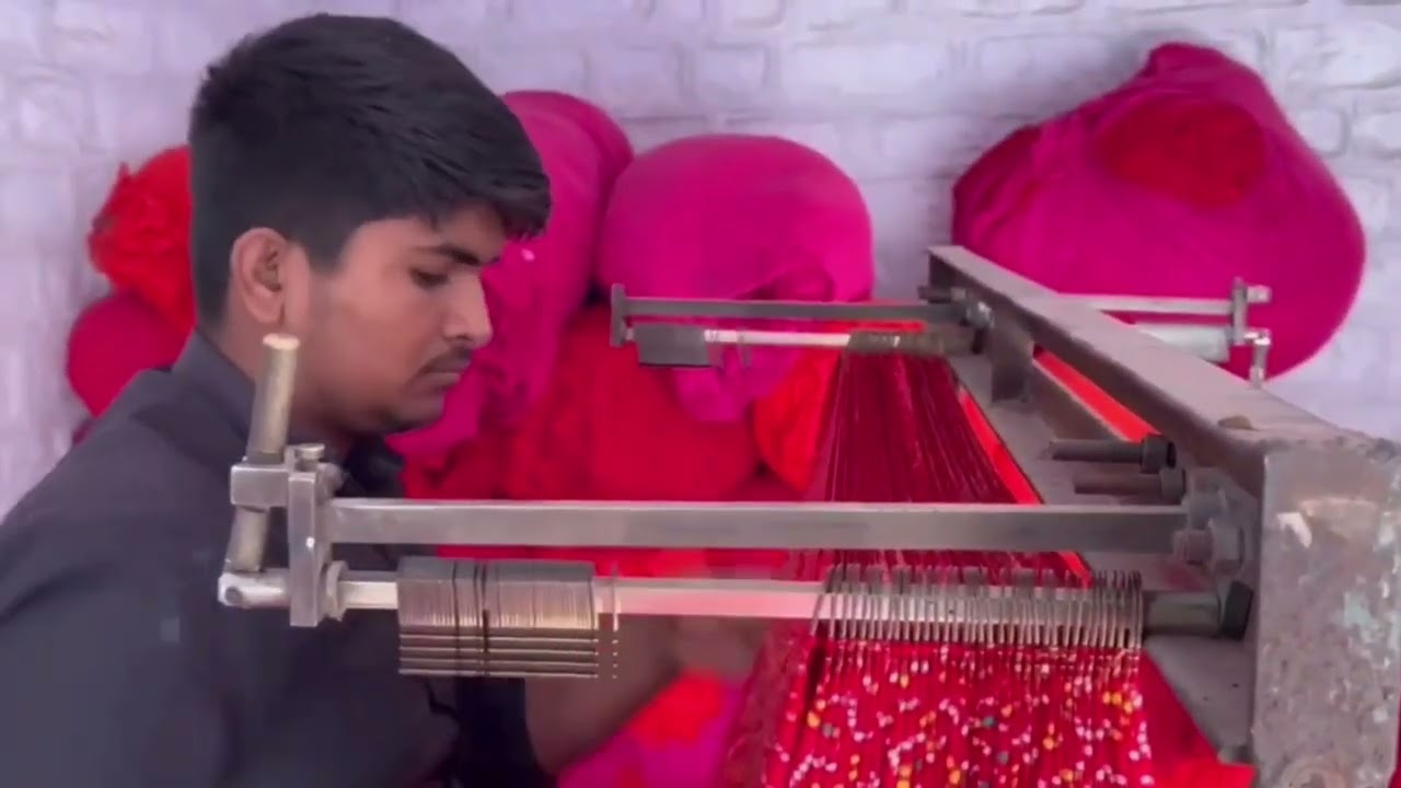 Recovered thumbnail from the historical Om Cloth Mills hero video showing textile production