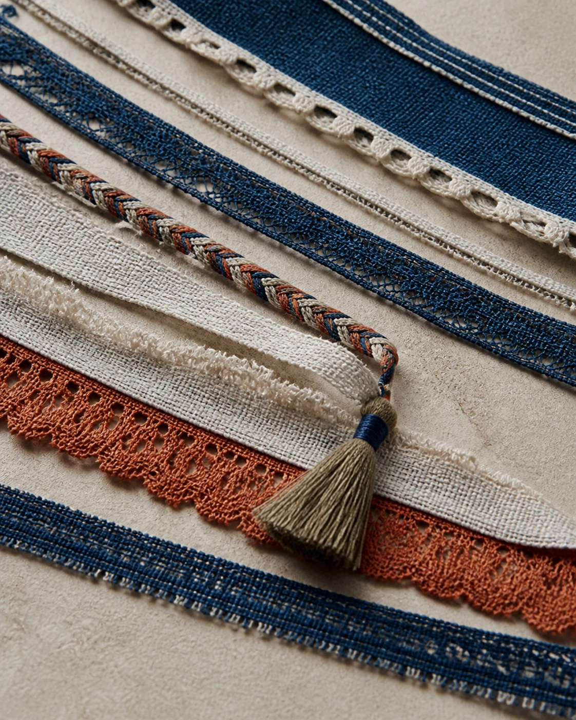 Indigo, ivory and terracotta textile lace and trim study